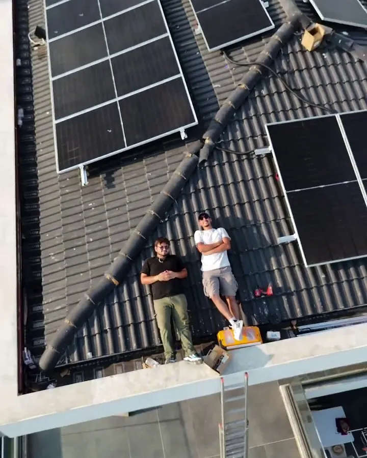 The Solar Nexo team on the roof checking solar panel and solar cable connections